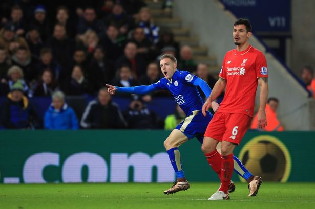 Leicester City's Jamie Vardy celebrates scoring his first goal of the game against Liverpool as Dejan Lovren looks