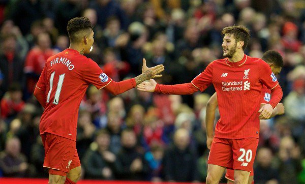 Liverpool's Adam Lallana celebrates the second goal against Sunderland with team-mate Roberto Firmino during the Premier League match at Anfield