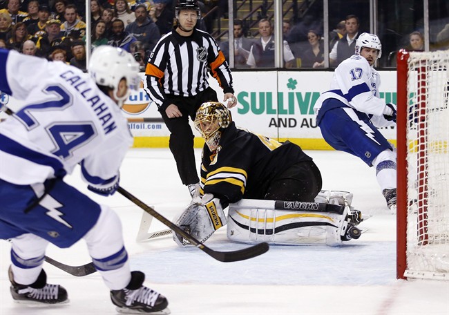 Tampa Bay Lightning's Ryan Callahan scores against Boston Bruins Tuukka Rask on an assist from teammate Alex Killorn during the first period of an NHL hockey game in Boston Sunday Feb. 28 2016