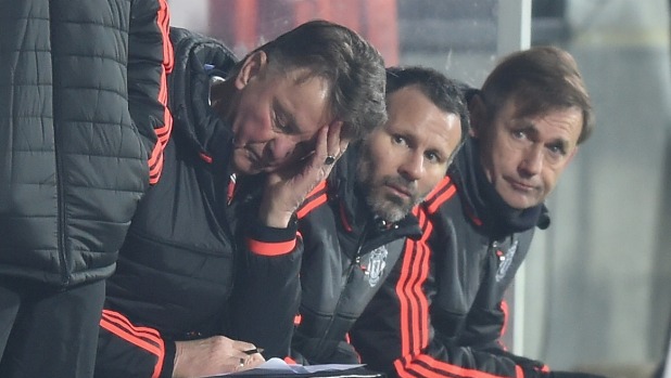 Manager Louis van Gaal can only scratch his head while assistant Ryan Giggs looks on as Manchester United's woes continued with a Europa League loss at FC Midtjylland