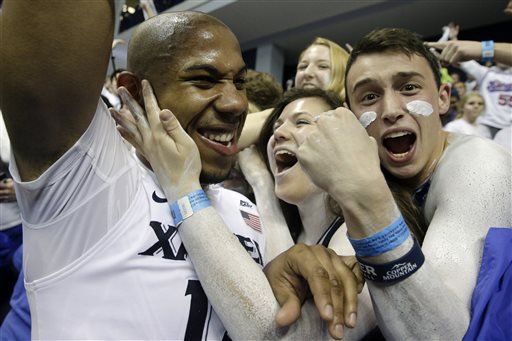 Xavier's Myles Davis left celebrates with fans after their NCAA college basketball game against Villanova Wednesday Feb. 24 2016 in Cincinnati. Xavier won 90-83