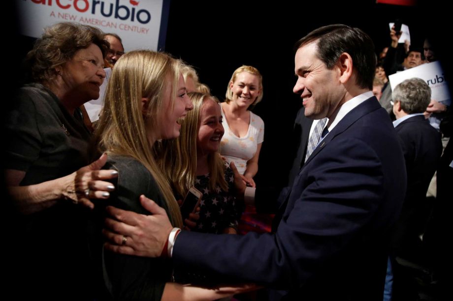 Republican presidential candidate Sen. Marco Rubio R-Fla right greets supporters after speaking at a rally Monday Feb. 22 2016 in Reno Nev