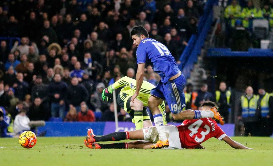 Chelsea's Diego Costa gets round Manchester United's goalkeeper David de Gea to score a goal during the English Premier League soccer match between Chelsea and Manchester United at Stamford Bridge stadium in London Sunday Feb. 7 2016