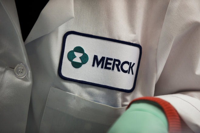 Merck logo is seen on a scientist's lab coat in West Point Pa. Merck reports financial results on Wednesday Feb. 3 2016