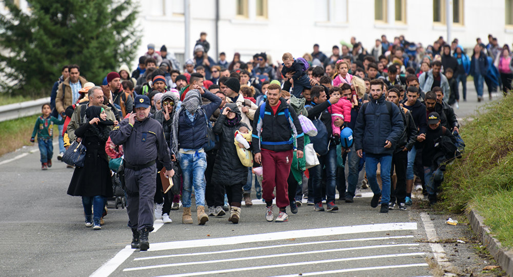 Migrants and refugees across the Slovenian Austrian border in Sentilj towards Spielfeld