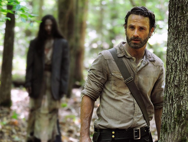 This image released by AMC shows Andrew Lincoln as Rick Grimes in a scene from the season four premiere of'The Walking Dead