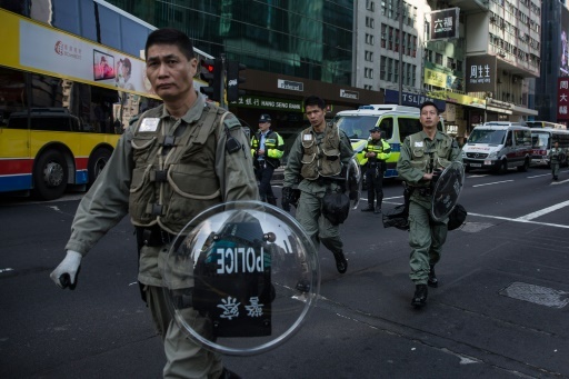 More than 30 Hong Kong protesters in court over riot