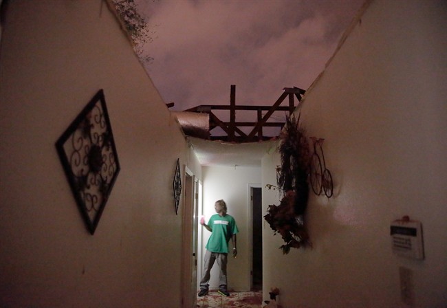 Enoch Kinard looks through his destroyed house at 1604 Ellerslie Ave. Tuesday Feb. 23 2016 in LaPlace La. A suspected tornado ripped through a Louisiana recreational vehicle park Tuesday leaving a mangled mess of smashed trailers and killing at least