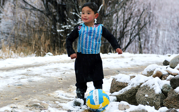 Murtaza Ahmadi only has a punctured ball to play with in his village in Afghanistan's Ghazni province