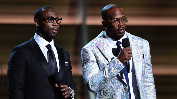 NFL player Anquan Boldin and NFL player Von Miller speak onstage during the 58th Annual Grammy music Awards