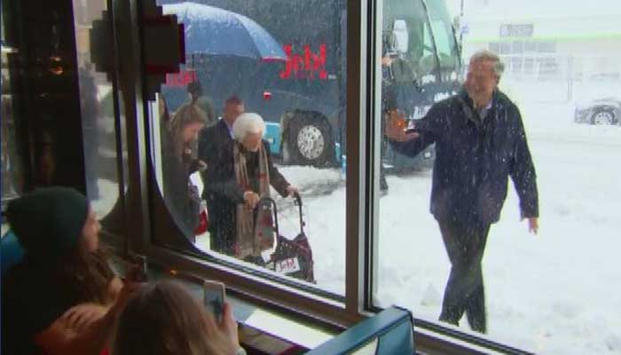 Republican presidential candidate waved at locals in a cafe Monday in Manchester NH. It was the candidates final full day of campaigning in the city before Tuesday's primary