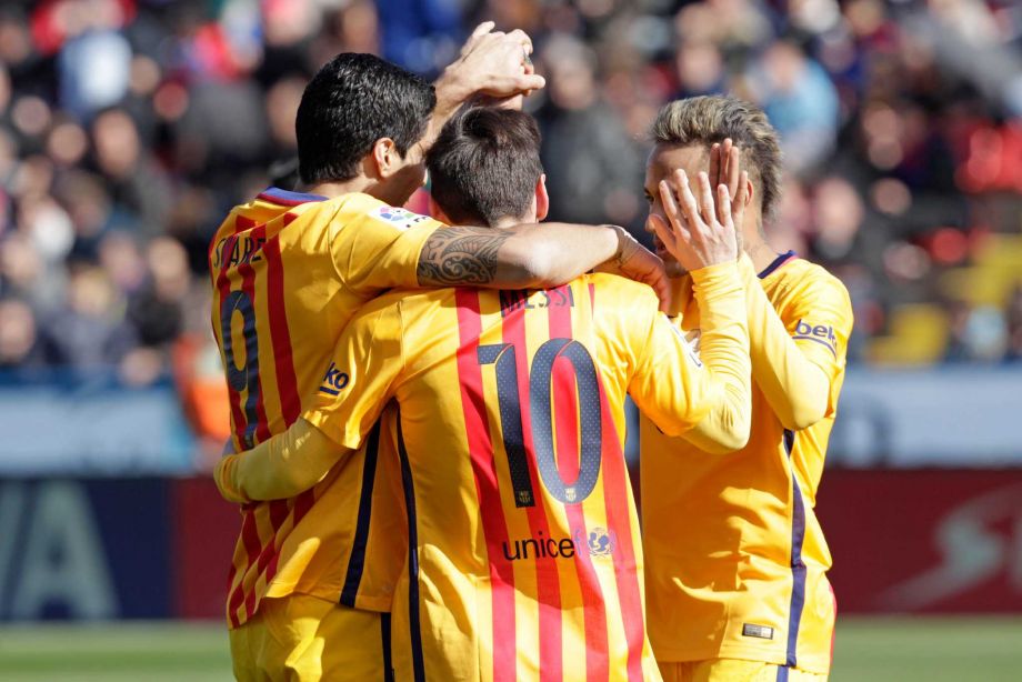 Barcelona's Luis Suarez left celebrates with Messi and Neymar right after scoring during a Spanish La Liga soccer match between Levante and Barcelona at the Ciutat de Valencia stadium in Valencia Spain Sunday Feb. 7 2016