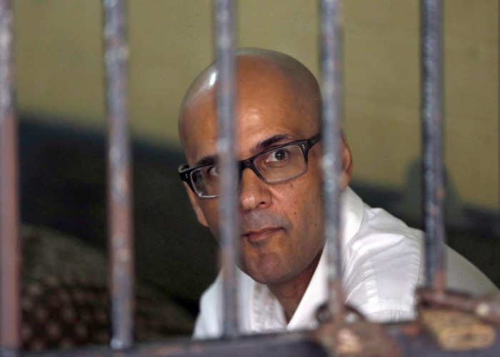 Canadian teacher Neil Bantleman is shown sitting inside a holding cell prior to the start of his trial hearing to listen to the prosecutor's demand at South Jakarta District Court in Jakarta Indonesia