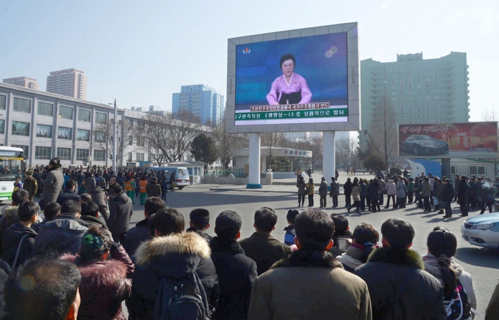 North Koreans watch a huge screen broadcasting an official announcement that the country ‘successfully’ put an Earth observation satellite into orbit calling it an ‘epoch-making’ achievement in Pyongyang. The country has been rather active of