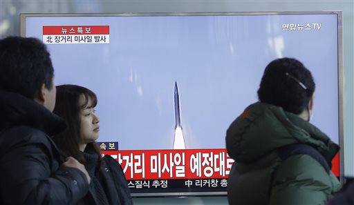 South Koreans watch a TV news program with a file footage about North Korea's rocket launch at Seoul Railway Station in Seoul South Korea on Sunday. North Korea on Sunday defied international warnings and launched a long-range rocket that the United Nati