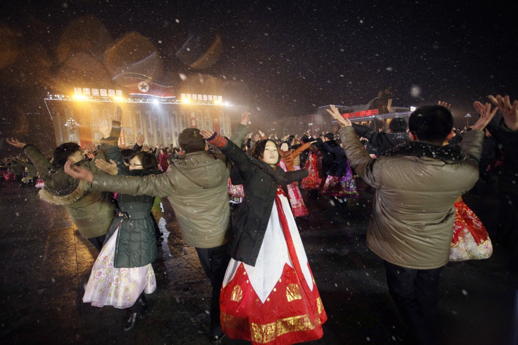 North Koreans dance in Kim Il Sung Square to celebrate the satellite launch on Feb. 8 in Pyongyang North