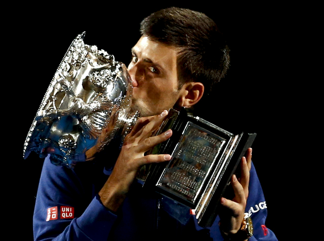 ASSOCIATED PRESS           Novak Djokovic of Serbia kisses his trophy after defeating Andy Murray of Britain in the men’s singles final at the Australian Open tennis championships in Melbourne Australia Sunday Jan. 31 2016