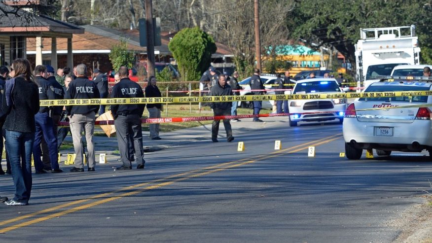 Officers investigating the shooting scene on Saturday