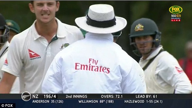 Australian bowler Josh Hazlewood angrily confronts umpire Ranmore Martinesz after a video review correctly upheld a not-out LBW decision against New Zealand batsman Kane Williamson