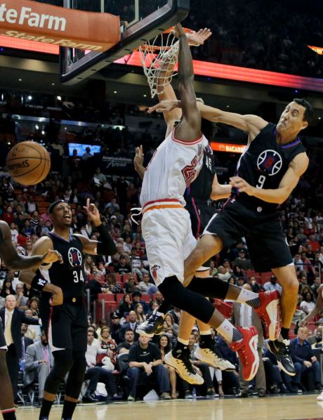 Heat forward Justise Winslow left absorbs a foul by Clippers guard Pablo Prigioni