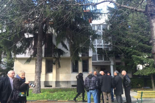 People gather in front of the Embassy of Palestine on Friday