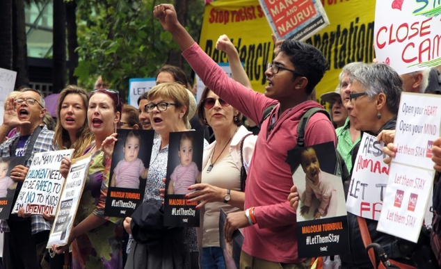 People protest outside an immigration office in Sydney