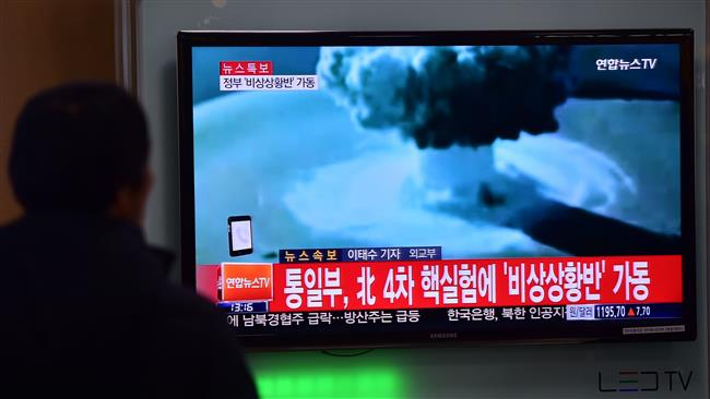 People watch a news report on North Korea's nuclear test on Jan 6