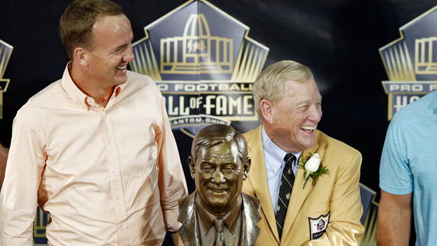 Peyton Manning stands by the side of Bill Polian at Polian's Pro Football Hall of Fame induction