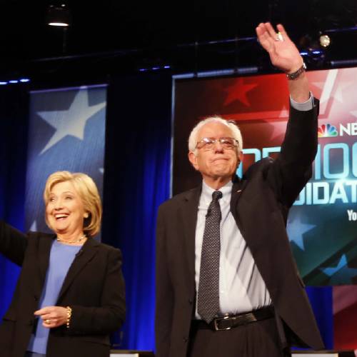 Democratic presidential candidates Hillary Clinton and Sen. Bernie Sanders I-Vt stand together before the start of the NBC You Tube Democratic presidential debate at the Gaillard Center in Charleston S.C