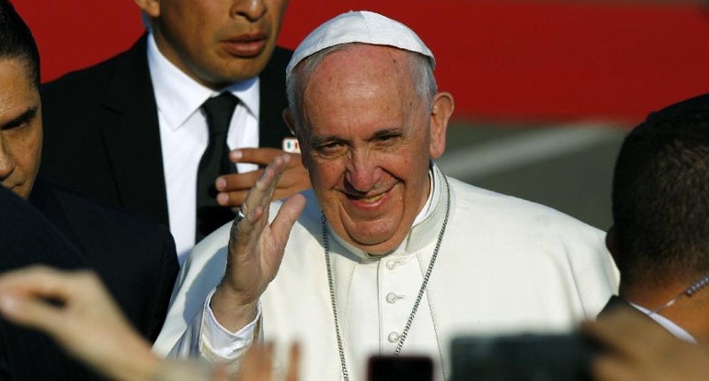 Pope Francis waves upon arrival at Francisco J. Mujica airport in Morelia Michoacan State Mexico