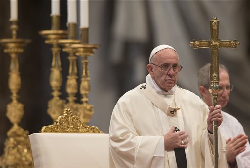 Pope Francis holds the pastoral staff as he celebrates a Mass for families