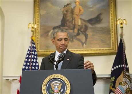 President Barack Obama walks up to the podium before speaking in the Roosevelt Room of the White House AP