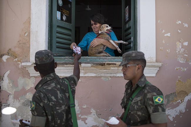 The Latest: Brazil finds active Zika virus in urine, saliva