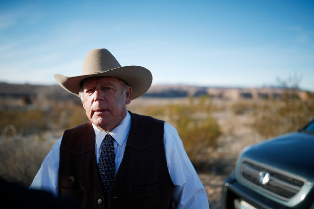 Rancher Cliven Bundy stands along the road near his ranch after speaking with media on Jan. 27 2016 in Bunkerville Nevada