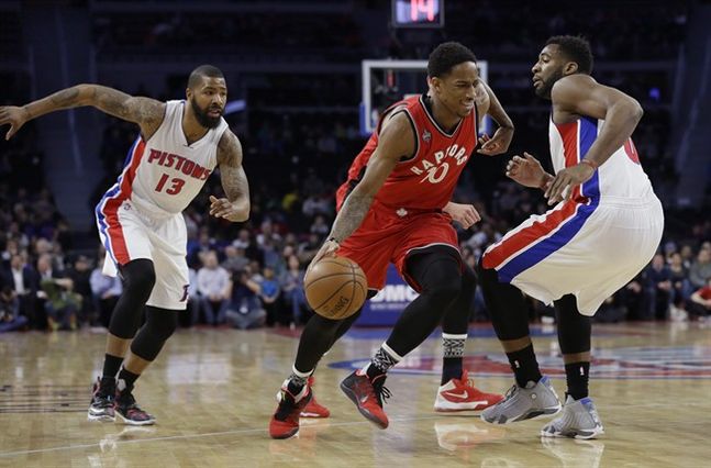 Toronto Raptors guard De Mar DeRozan drives on Detroit Pistons center Andre Drummond right during the first half of an NBA basketball game Monday Feb. 8 2016 in Auburn Hills Mich