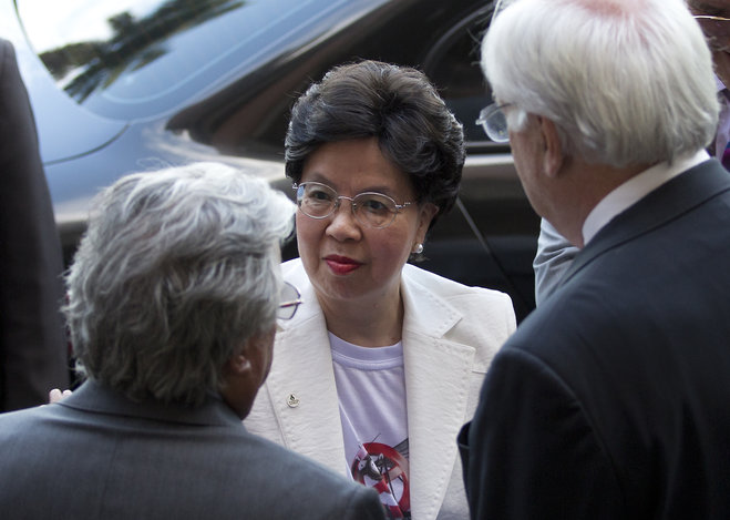 Director General of the World Health Organization Margaret Chan center listens to Paulo Gadelha President of the Oswaldo Cruz Foundation Brazil ™s premier state-run research institute for tropical diseases left in Rio de Janeiro Brazil Wednesda