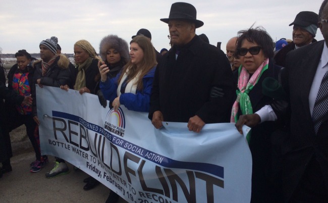 Rev. Jesse Jackson leads march in downtown Flint