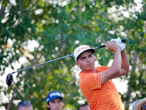 Rickie Fowler of the United States plays a shot during in the final of the Abu Dhabi Golf Championship in the capital of the United Arab Emirates