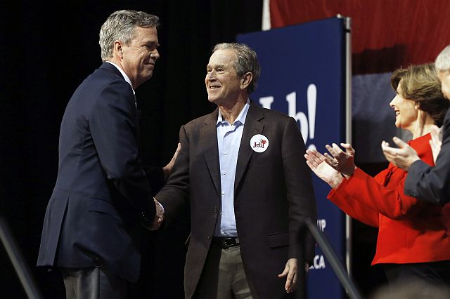 Republican presidential candidate and former Florida Gov. Jeb Bush shakes hands with his brother former President George W. Bush as Laura Bush and Sen. Lindsey Graham look