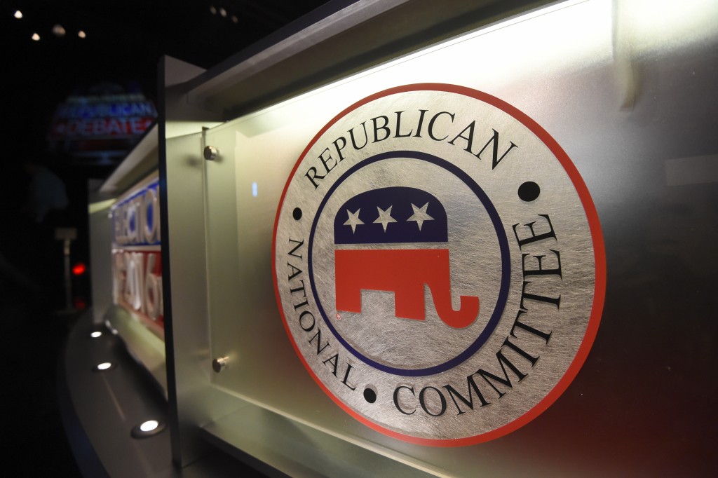 The Republican National Committee logo is shown on the stage as crew members work at the North Charleston Coliseum Wednesday Jan. 13 2016 in North Charleston S.C. in advance of Thursday's Fox Business Network Republican presidential debate. (AP Phot