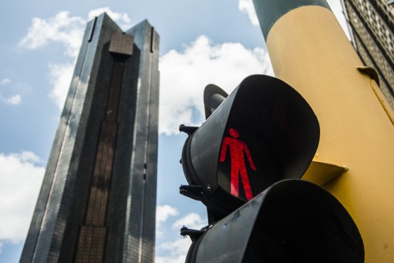 A red pedestrian crossing light shows on a road near the headquarters of the South African Reserve Bank left in the central business district in Pretoria South Africa on Tuesday Dec. 15 2015. South Africa's new Finance Minister Pravin Gor