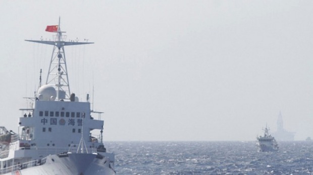 Ships of Chinese Coast Guard are seen near the Chinese oil rig Haiyang Shi You 981 in disputed waters in the South China Sea