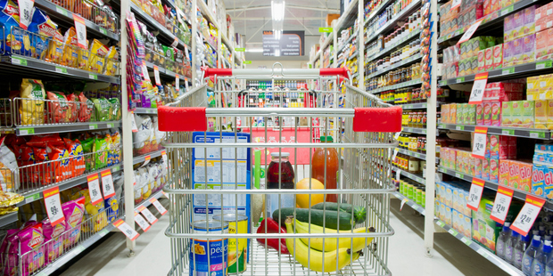 Shopping cart in grocery store aisle