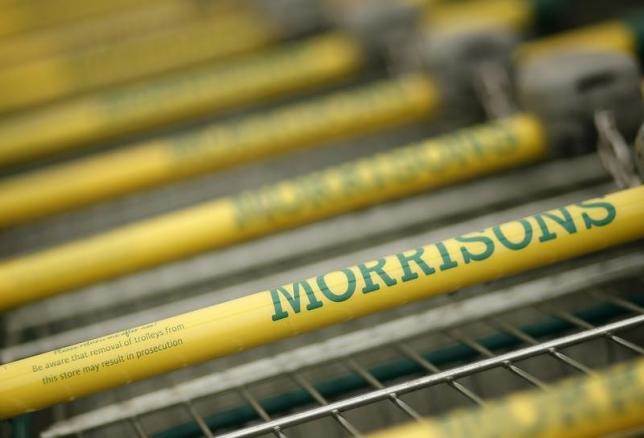 Shopping trolleys stand outside a Morrisons supermarket in Liverpool northern England