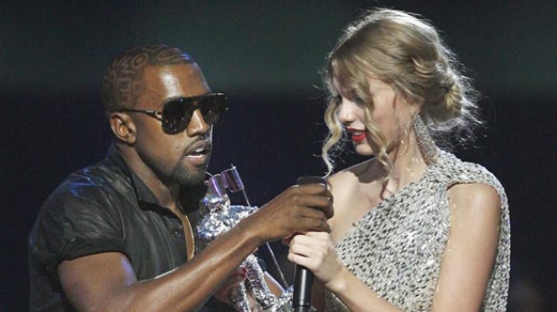 Singer Kanye West takes the microphone from singer Taylor Swift during the MTV Video Music Awards in September 2009