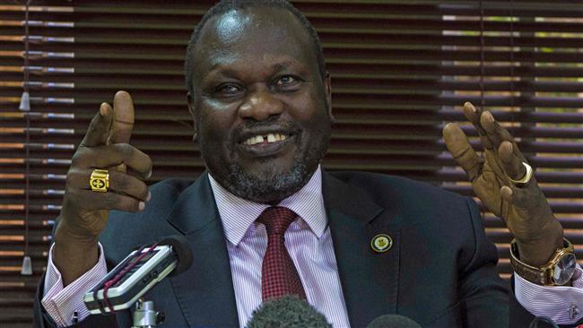 South Sudan's rebel leader Riek Machar gestures as he holds a press conference in Kampala Uganda Jan. 26 2016