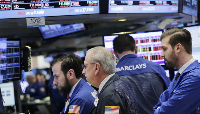 Stock traders work at the New York Stock Exchange Thursday Feb. 11 2016 in New York