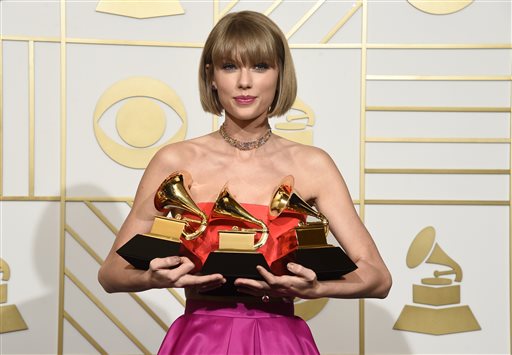 Taylor Swift poses in the press room with the awards for album of the year for 1989 pop vocal album for 1989 and best music video for'Bad Blood at the 58th annual Grammy Awards at the Staples Center on Monday Feb. 15 2016 in Los Angeles