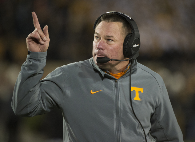 Tennessee head coach Butch Jones points to the scoreboard during the first quarter of an NCAA college football game