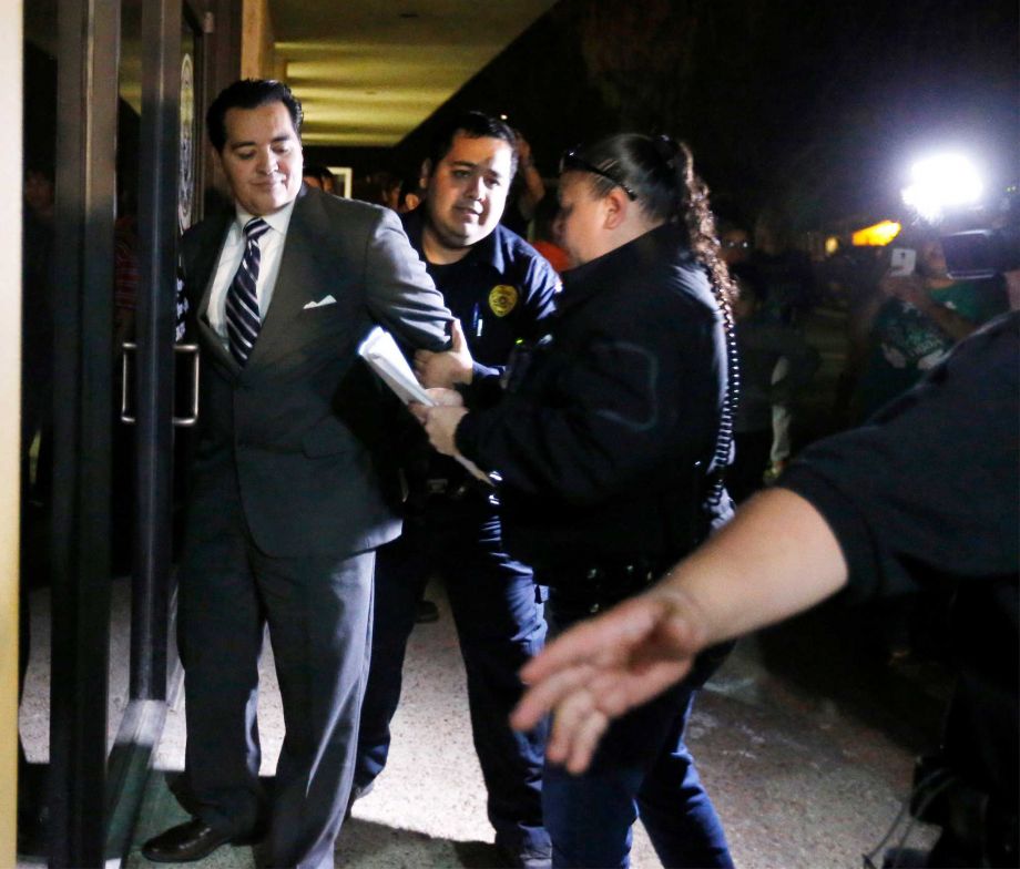 Feb. 16 2016 Crystal City Mayor Ricardo Lopez is taken away from city hall by police in Crystal City Texas after allegedly disrupting a City Council meeting while fighting a recall effort that began before his indictm